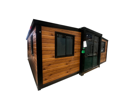 Portable cabin with wooden exterior and glass windows on a white background