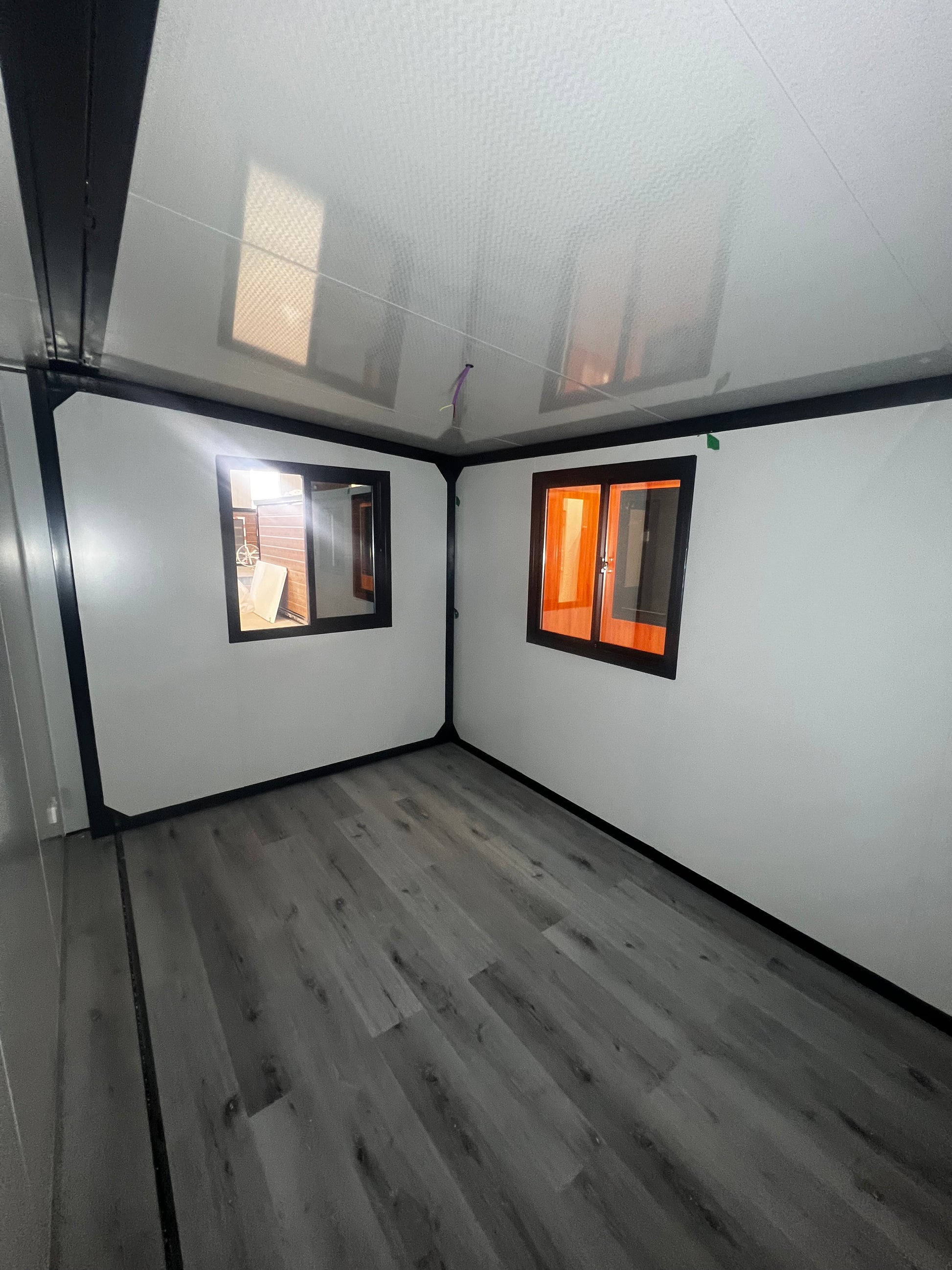 Ceiling with a skylight and wooden wall paneling