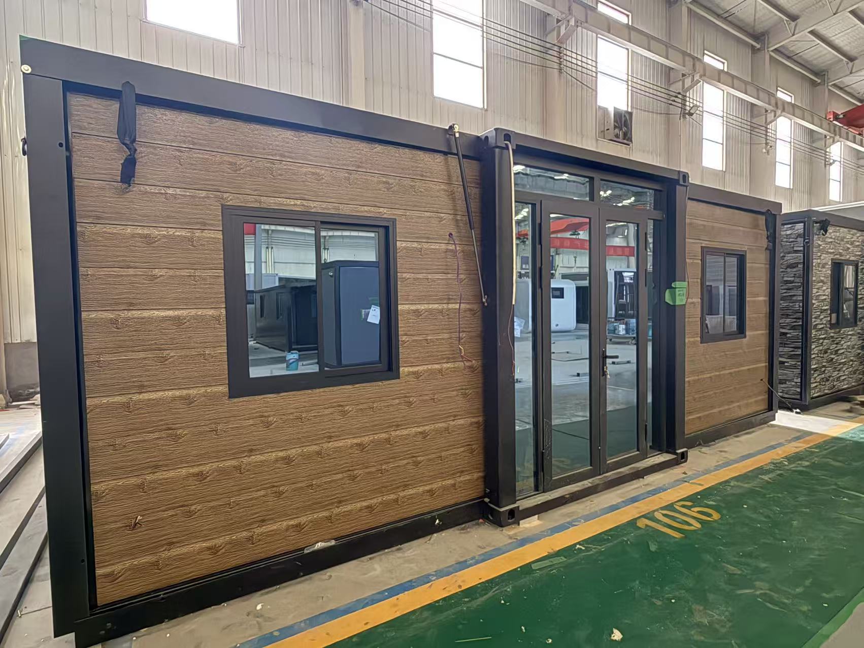 Modular  cabin with wooden  exterior and black trim 
