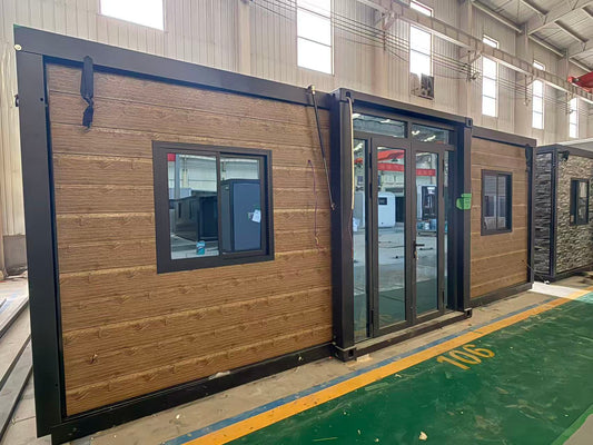 Modular  cabin with wooden  exterior and black trim 