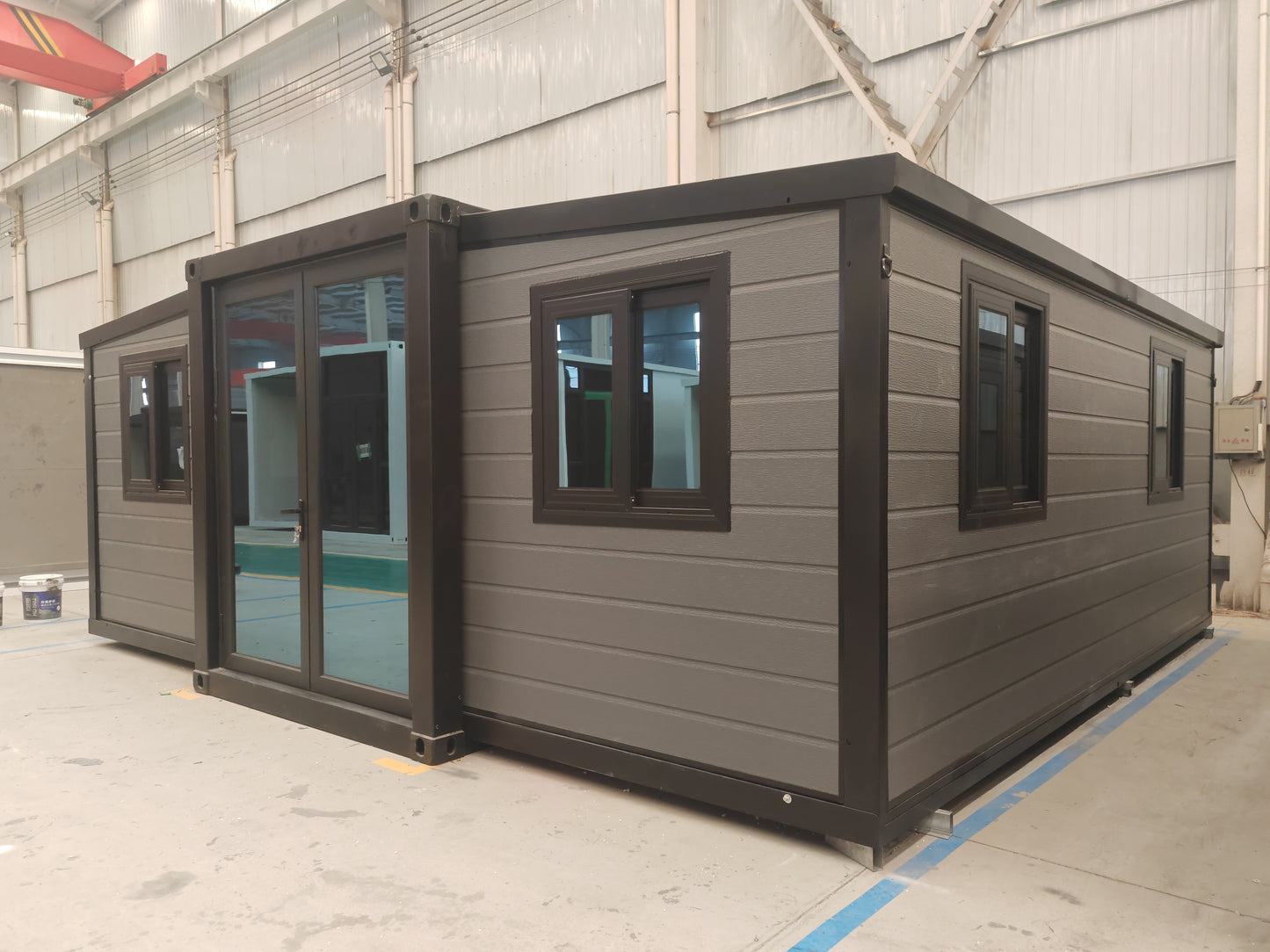 Modular  cabin with gray exterior and black trim 