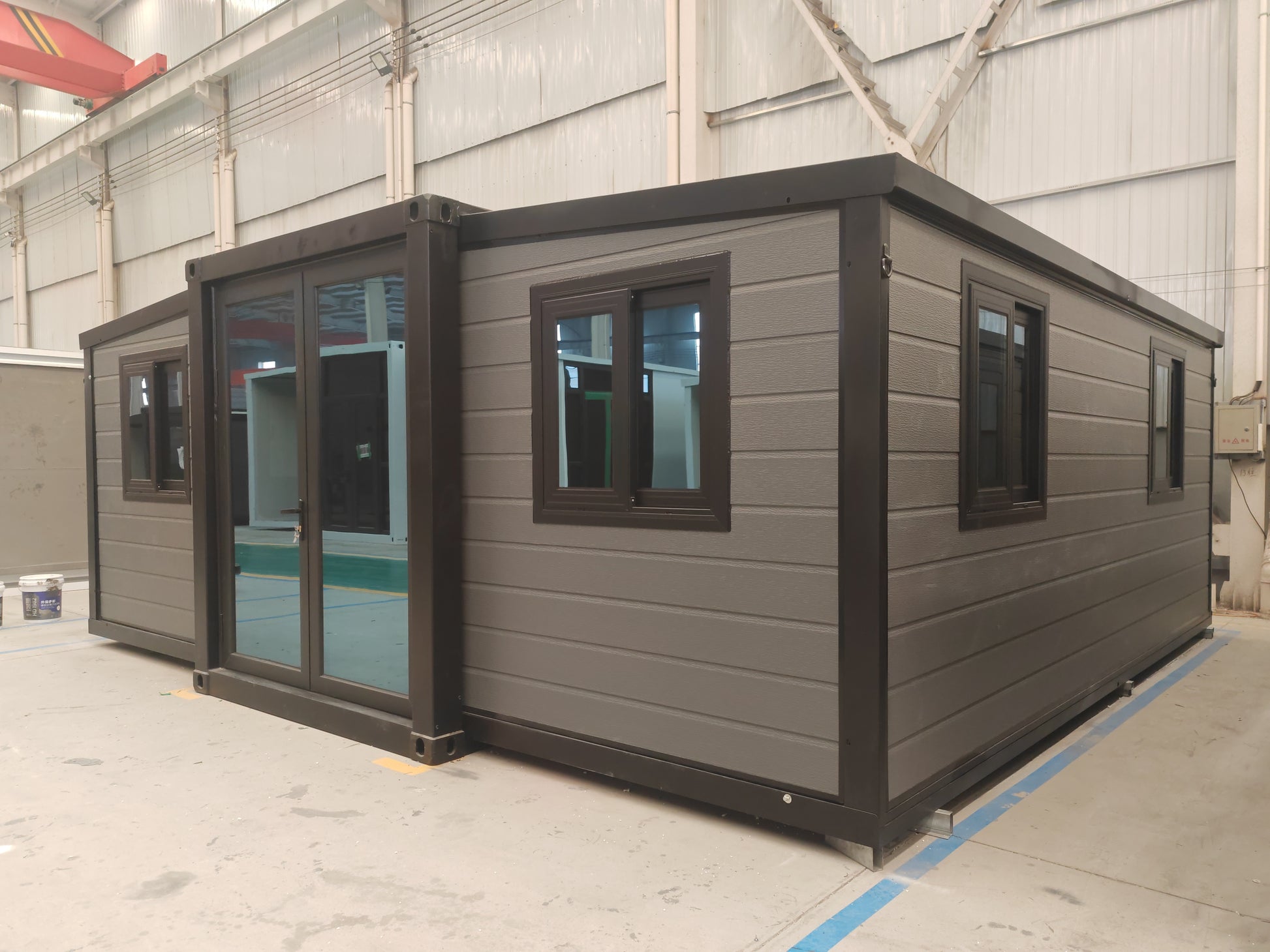 Modular  cabin with gray exterior and black trim 
