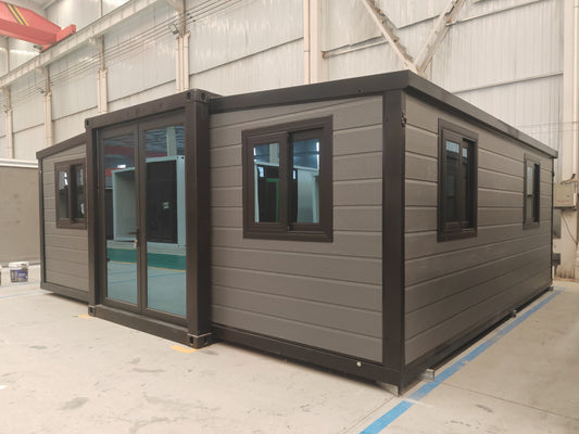 Modular  cabin with gray exterior and black trim 