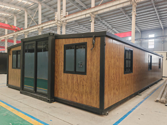 Modular wooden cabins in a warehouse setting