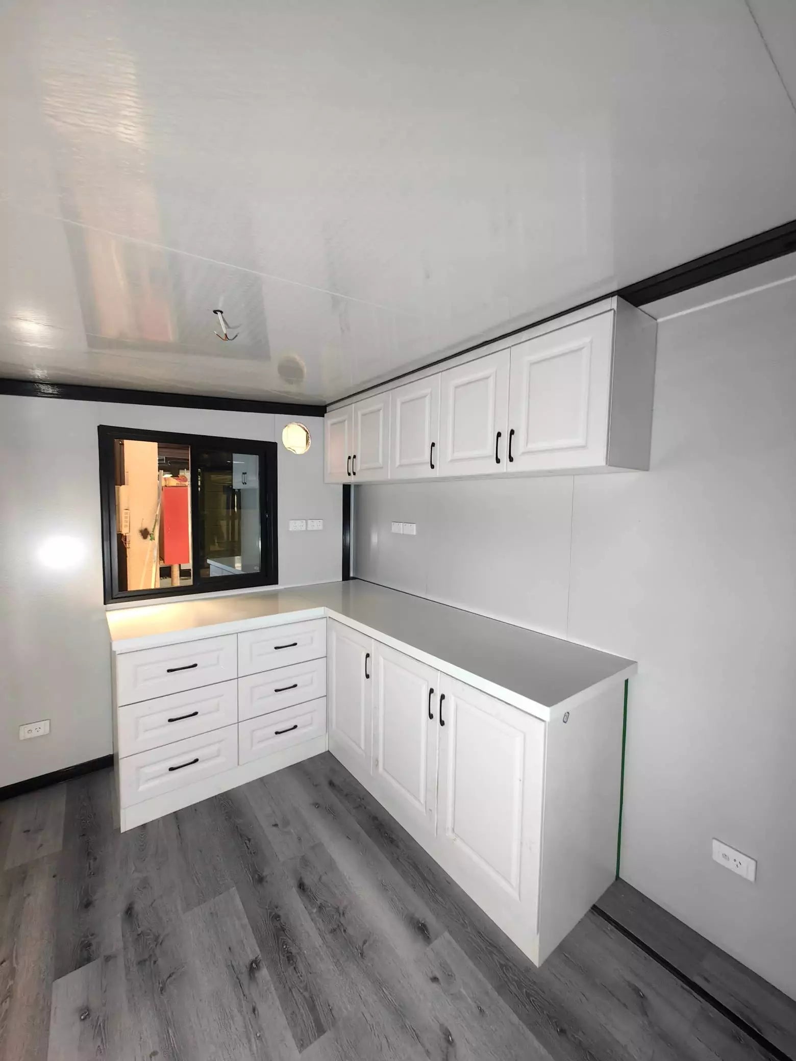L type cabinet with overhead storage