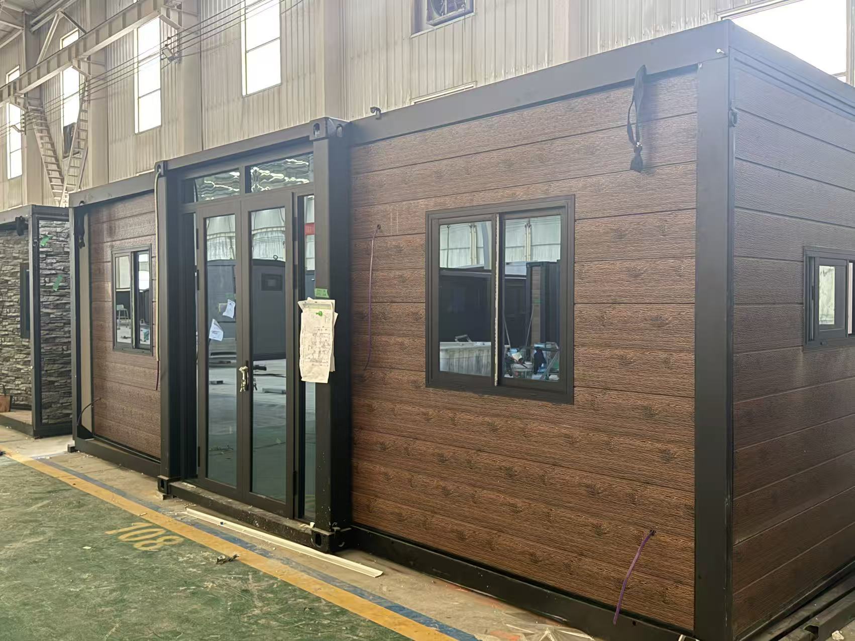 Flat expandable home model FE40 with timber look cladding