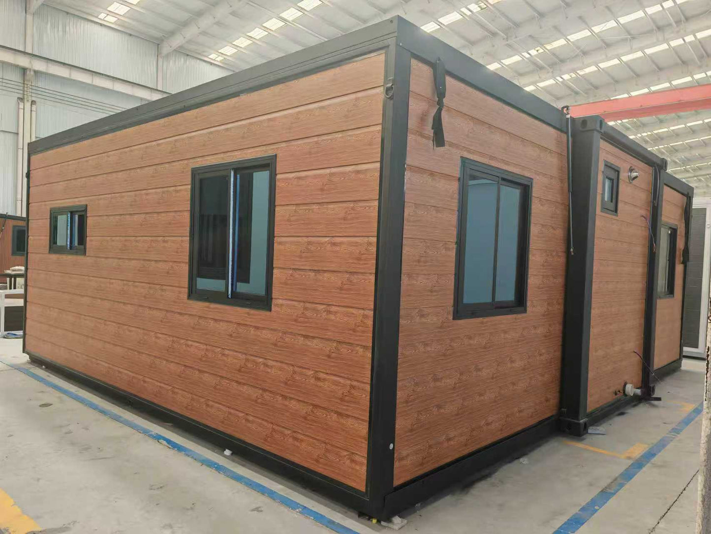 FE40 expandable homes with black frame and timber look cladding