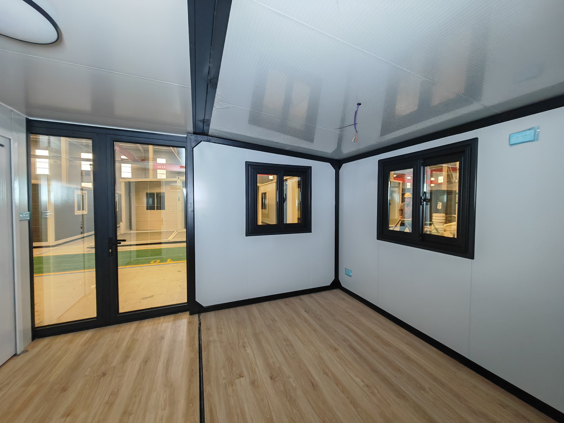 Entrance area with wooden flooring and white EPS/PU walls and ceiling